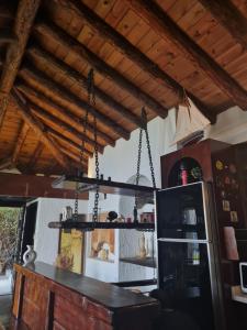 een kroonluchter aan het plafond in een keuken bij Escape to History in a Stunning Stone House with Garden and Sea View in the Heart of Alanya in Alanya