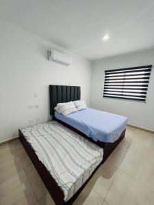 Ένα ή περισσότερα κρεβάτια σε δωμάτιο στο Sexy Casa 12 Alberca Templada Playa