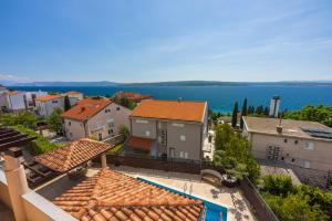 an aerial view of a town with houses and the water at DOLLY LUX in Crikvenica