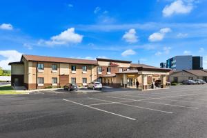 a parking lot in front of a hotel at Red Roof Inn Denver in Denver