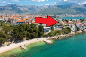 an aerial view of a beach with a red arrow at Mer Vue - 3 floor Private House by the Sea in Split