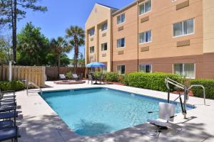 a swimming pool in front of a building at Fairfield Inn Jacksonville Orange Park in Orange Park