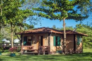 a small cabin in the grass with a tree at Hotel Santa Esmeralda in Bonito +274 photos