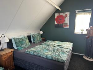 Ένα ή περισσότερα κρεβάτια σε δωμάτιο στο Bed&Breakfast de Hooimoat