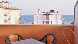 a balcony with a view of the ocean at Hotel Venezuela in Lido di Jesolo