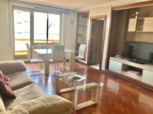 a living room with a couch and a glass table at Apartamentos Azafranal-PARKING GRATIS- in Salamanca +40 photos