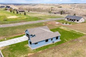 an overhead view of a house in a field at Sleek Red Lodge Home Rental with Private Hot Tub! in Red Lodge
