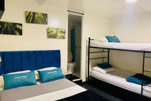 Postel nebo postele na pokoji v ubytování Hotel Bogota Home