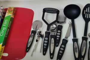 a group of kitchen utensils sitting on a counter at *2a* ground floor house setup for your most amazing & relaxed stay + Free Parking + Free Fast WiFi in Beeston
