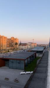 arial view of a building in a city with buildings at Hotel Mar Azul in Espinho