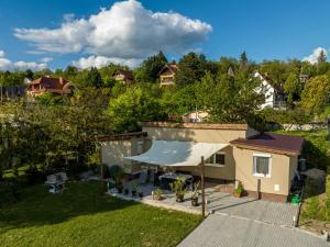 an overhead view of a house with a tent at Fekete Orchidea Apartman in Balatonkenese