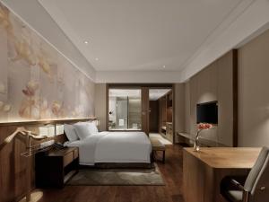 Postel nebo postele na pokoji v ubytování Crowne Plaza Fuzhou Riverside by IHG