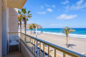 a balcony with a view of the beach at Miramar in Carboneras