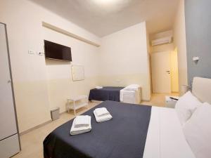 Voodi või voodid majutusasutuse Bonaini Relax B&B toas