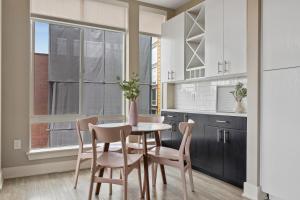 a kitchen with a table and chairs and a window at Kasa Union Station Denver in Denver