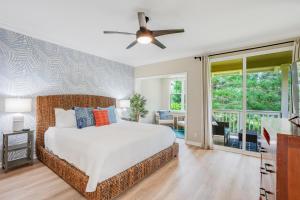 a bedroom with a bed and a ceiling fan at Nihilani at Princeville 19C in Princeville