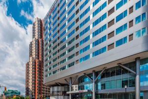 a large office building with a lot of windows at Residence Inn by Marriott Jersey City in Jersey City