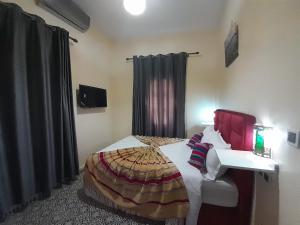 Hotel Mentaga客房内的一张或多张床位