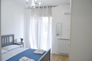 Postel nebo postele na pokoji v ubytování Caporama