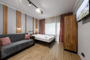 Säng eller sängar i ett rum på Нові затишні smart-квартири LеГо
