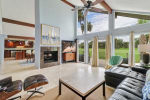 a living room with a couch and a fireplace at 7 Ginger Beer - Fairway Breeze in Hilton Head Island