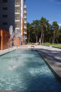 a fountain in the middle of a building at Porta Mare Apartments LuxView in Dziwnówek