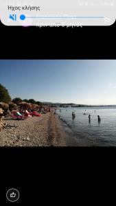 a screenshot of a beach with people in the water at 150ευρώ η μέρα in Oropós