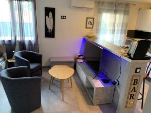 Część wypoczynkowa w obiekcie Grand studio très agréable avec bar, cuisine et terrasse