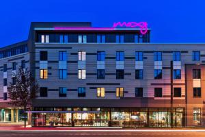 a building with a msx sign on top of it at Moxy Duesseldorf South in Düsseldorf