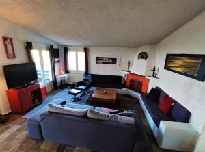 a living room with a couch and a table at I GABBIANI in Pefkochori