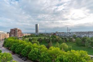 a park with trees and buildings in a city at Kasa Union Station Denver in Denver