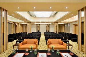 a large room with chairs and tables in a room at Fairfield by Marriott Amritsar in Amritsar