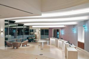 a lobby with chairs and tables in a building at Courtyard by Marriott Marina del Rey in Los Angeles