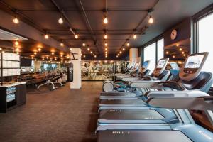 a gym with a row of cardio machines at Hotel EMC2, Autograph Collection in Chicago
