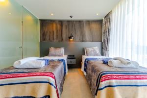 A bed or beds in a room at Villa Kazarman, Kalkan’ın kalbinde denize, merkeze