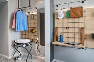 two images of a room with a closet at Moxy Bristol in Bristol +61 photos