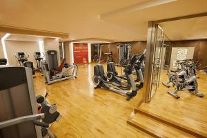 a gym with several treadmills and elliptical machines at Sheraton Athlone Hotel in Athlone