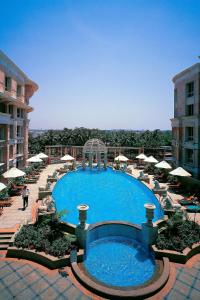 a large swimming pool on top of a building at ITC Maratha, a Luxury Collection Hotel, Mumbai in Mumbai