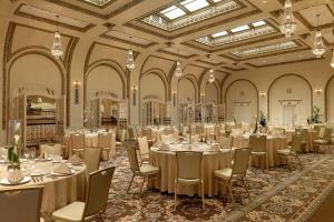 a large banquet hall with tables and chairs in it at Hotel Blackhawk, Autograph Collection in Davenport