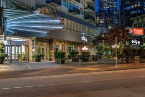 an empty street in front of a building at night at Best Western Premier Chateau Granville Hotel & Suites & Conference Centre in Vancouver