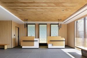 an office with two desks in a room with windows at Fairfield by Marriott Wakayama Kushimoto in Kushimoto