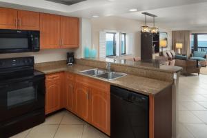 a kitchen with a sink and a dishwasher at Vistana Beach Club in Jensen Beach