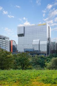 a large building in the middle of a city at Courtyard by Marriott Seoul Pangyo in Seongnam