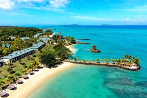 - une vue aérienne sur le complexe et l'océan dans l'établissement Sheraton Samoa Beach Resort, à Mulifanua