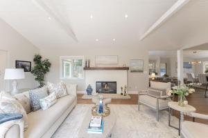a living room with a couch and a fireplace at 3888 Seas the Day home in Carmel