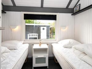 Postel nebo postele na pokoji v ubytování Holiday home Hemmet CCLXIII