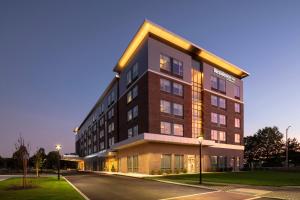 a large building with a street in front of it at Residence Inn by Marriott Boston Natick in Natick