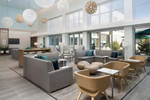 a large lobby with couches and tables and windows at Element Sedona in Sedona