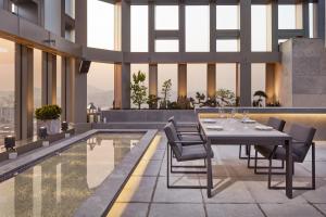 a dining room with a table and chairs on a building at Four Points by Sheraton Seoul Gangnam in Seoul