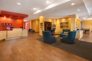 a lobby with couches and chairs in a hospital at TownePlace Suites by Marriott Hobbs in Hobbs